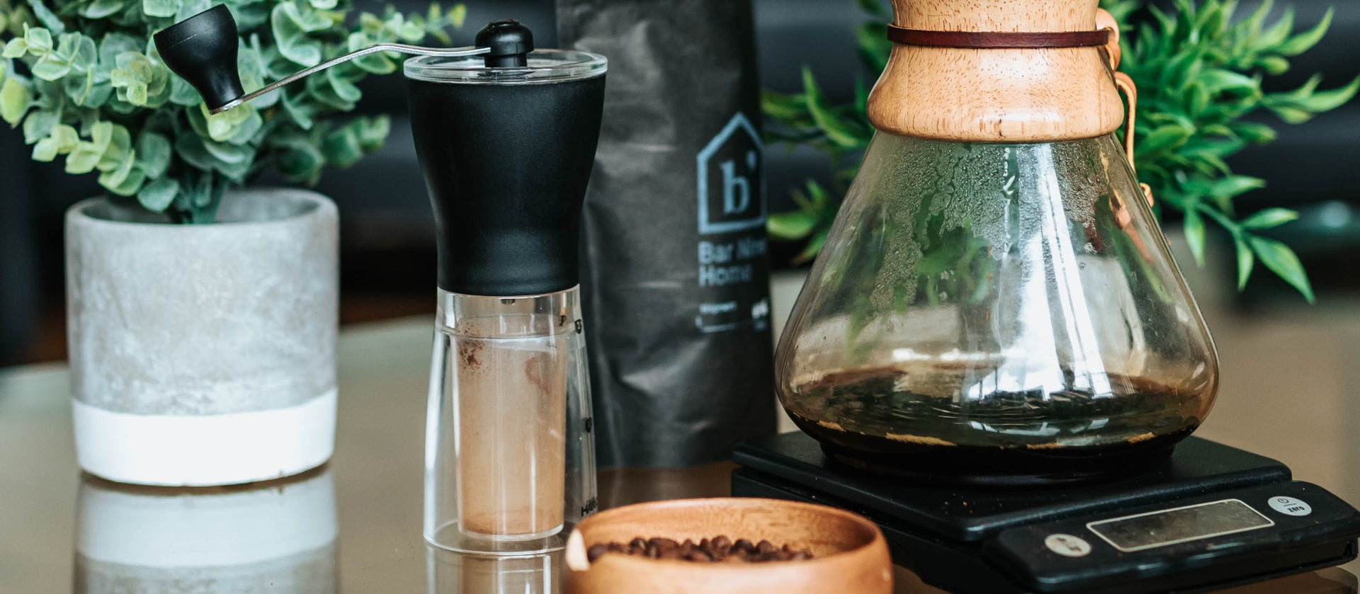 Some coffee accessories, including a Chemex coffee maker
