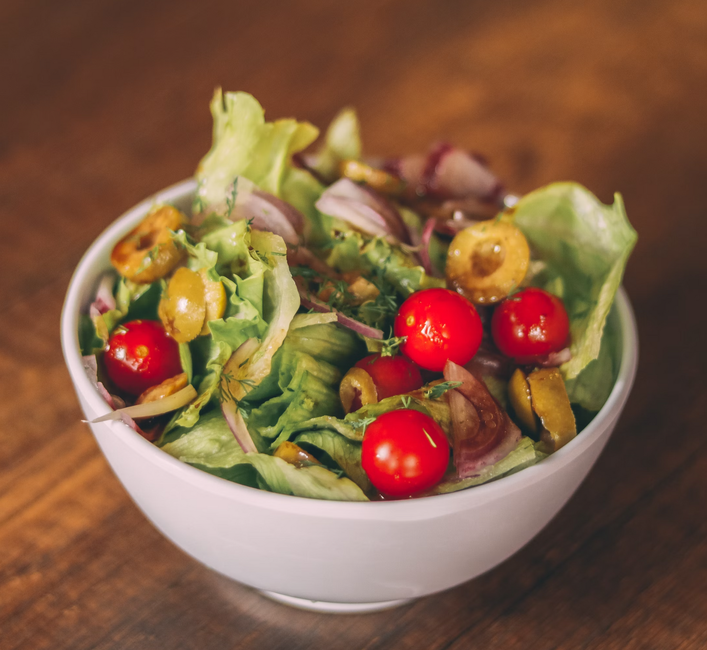 Small garden salad with cherry tomatoes and olives